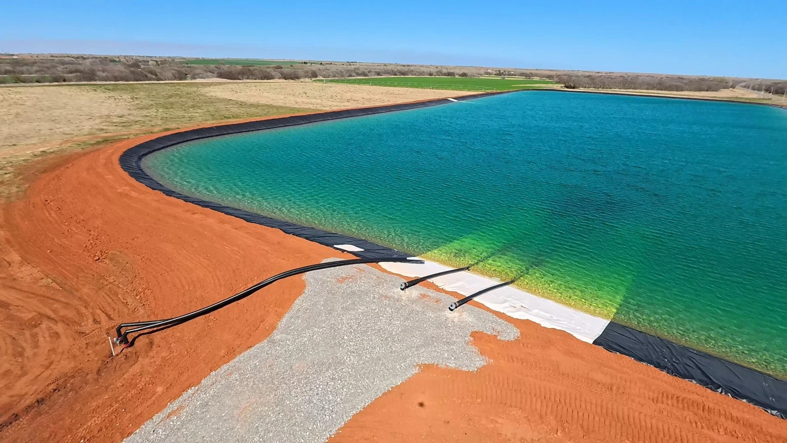 Water lines entering the lined Trident Water pit