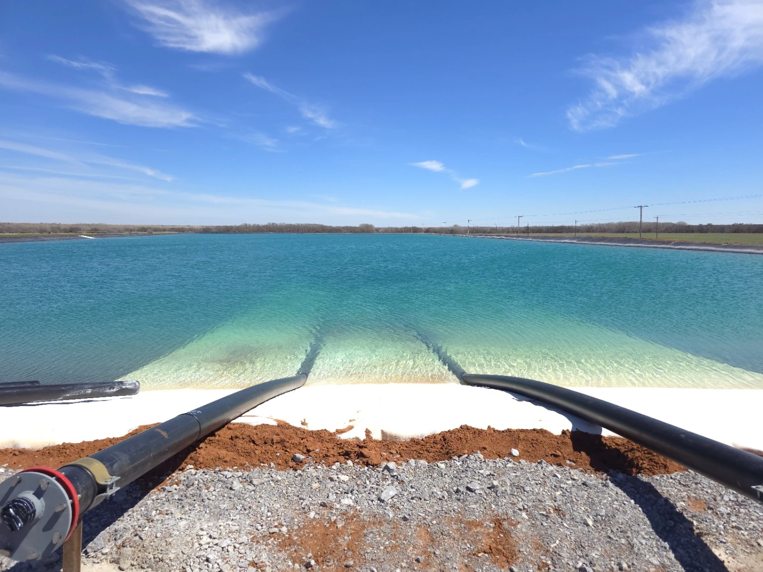Clear water and the lined bank at Trident Water Pit #1